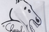 a t - shirt with a drawing of a horse on it