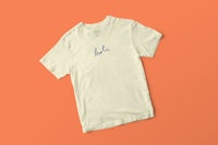 a white t - shirt with blue writing on it